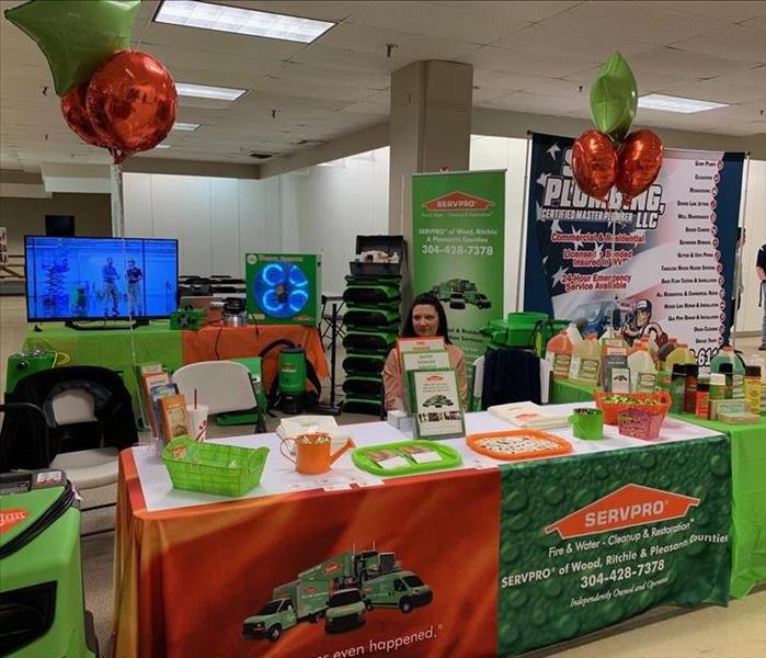 A table at the home show with servpro marketing props